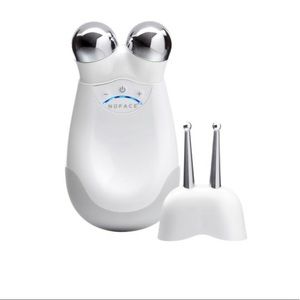 Nuface facial toning device with ele attachment.